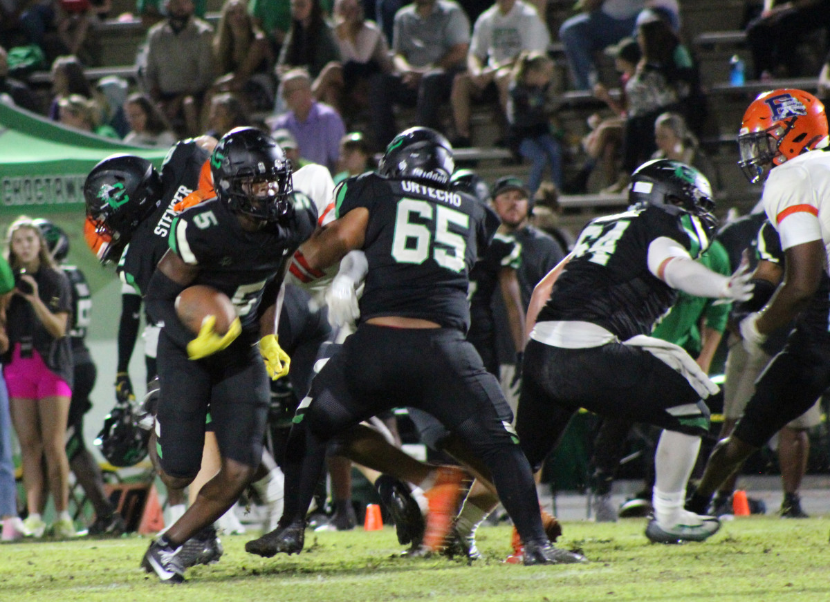 Choctaw's Jonathan Boyd runs behind his offensive line in the Indians district victory over Escambia.