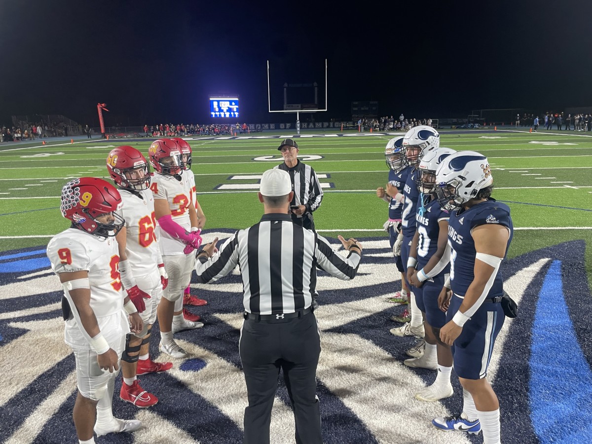 The coin toss before the game Friday. 