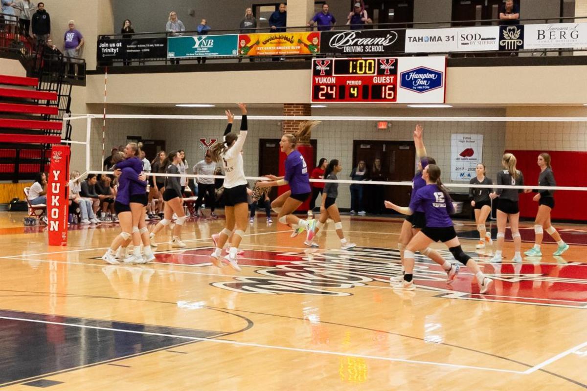 Community Christian celebrates the winning point in the fourth set that clinched the Royals' third state championship in four years Saturday in Yukon.