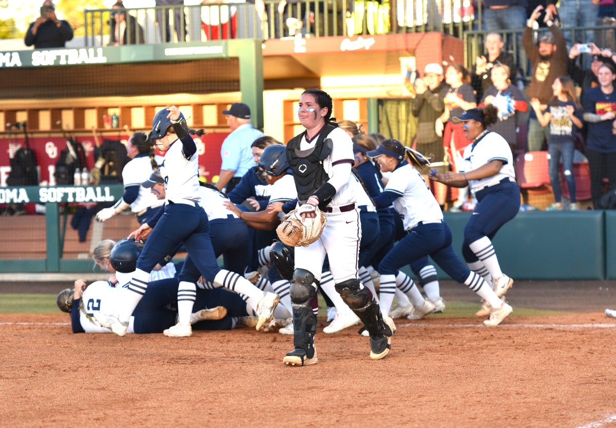 Southmoore players swarm one another after the SaberCats pulled off a 2-1 win against Edmond Memorial in the 6A championship game on Oct. 14, 2023.