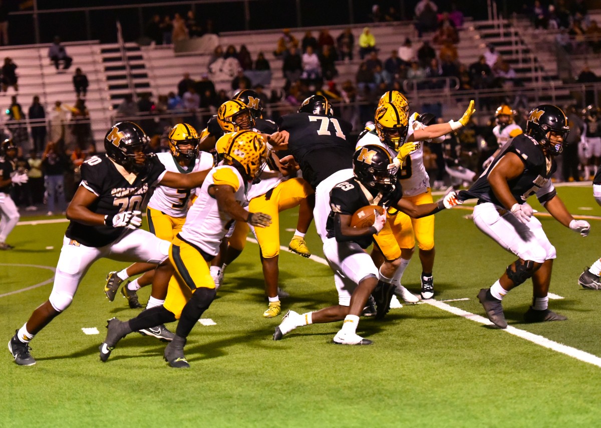 Midwest City senior tailback Lasiera Laviolette (with ball) helped the Bombers to a 42-7 win against previously undefeated Lawton MacArthur on Oct. 13, 2023.