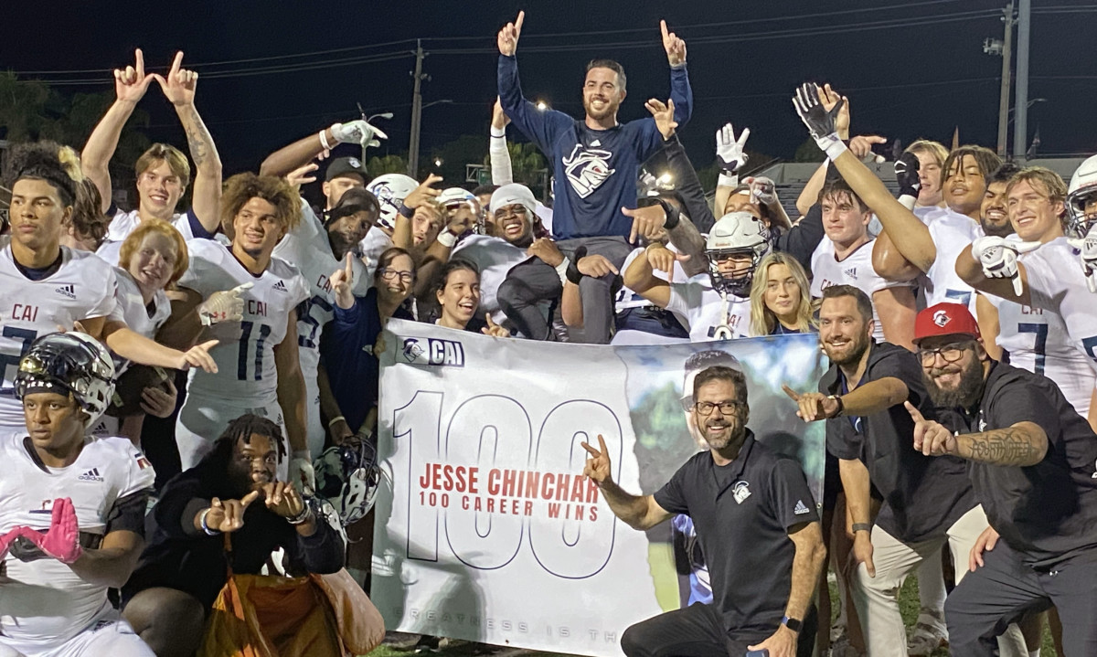 Clearwater Academy International football coach Jesse Chinchar gets a shoulder ride and a Gatorade bath after winning his 100th game in come-from-behind fashion at Lakeland.
