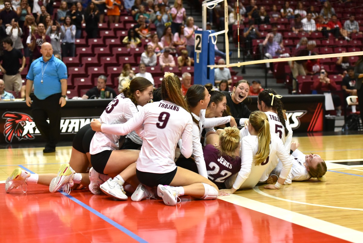 Jenks volleyball players celebrate after winning the Class 6A state championship Oct. 21, 2023. 
