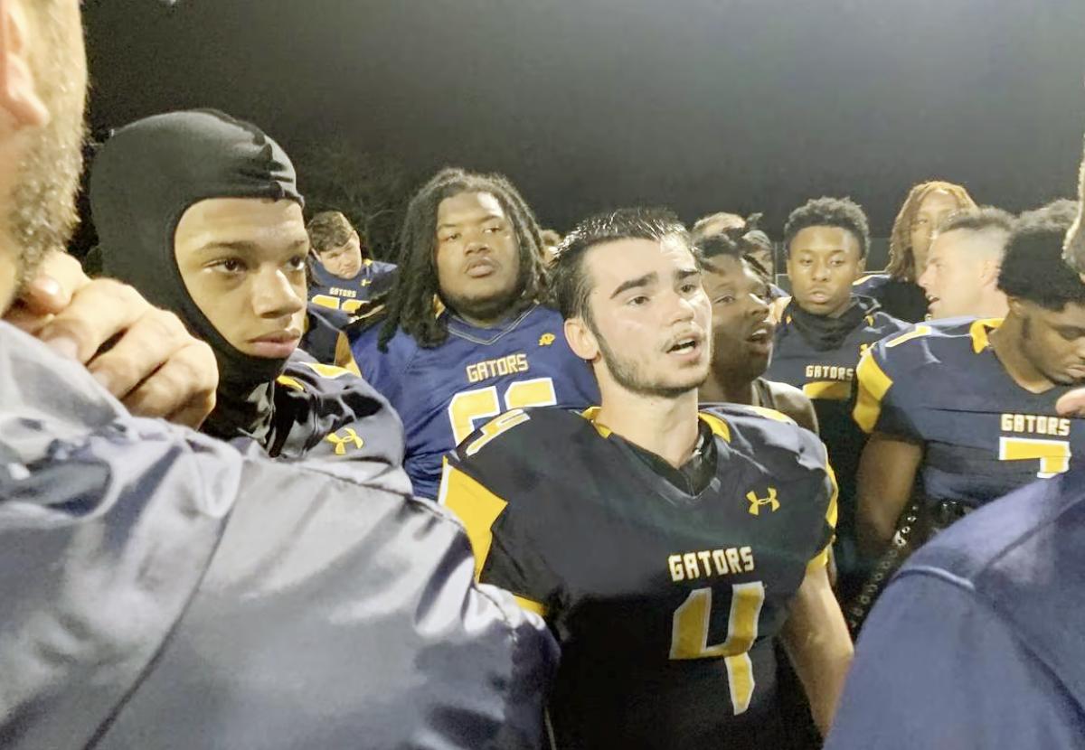 Jacob Wagner (4) listens to coach Ryan Pittillo after last year's playoff victory over Mervo. The Gators have carried the momentum into this season with an 8-0 record, including a road victory over defending Class 2A state champ Milford Mill last weekend.