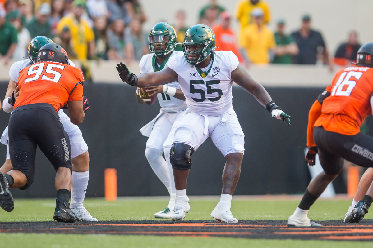Baylor Bears offensive lineman Xavier Newman-Johnson (55) blocks during the first quarter against the Oklahoma State Cowboys at Boone Pickens Stadium. OSU won 24-14. 