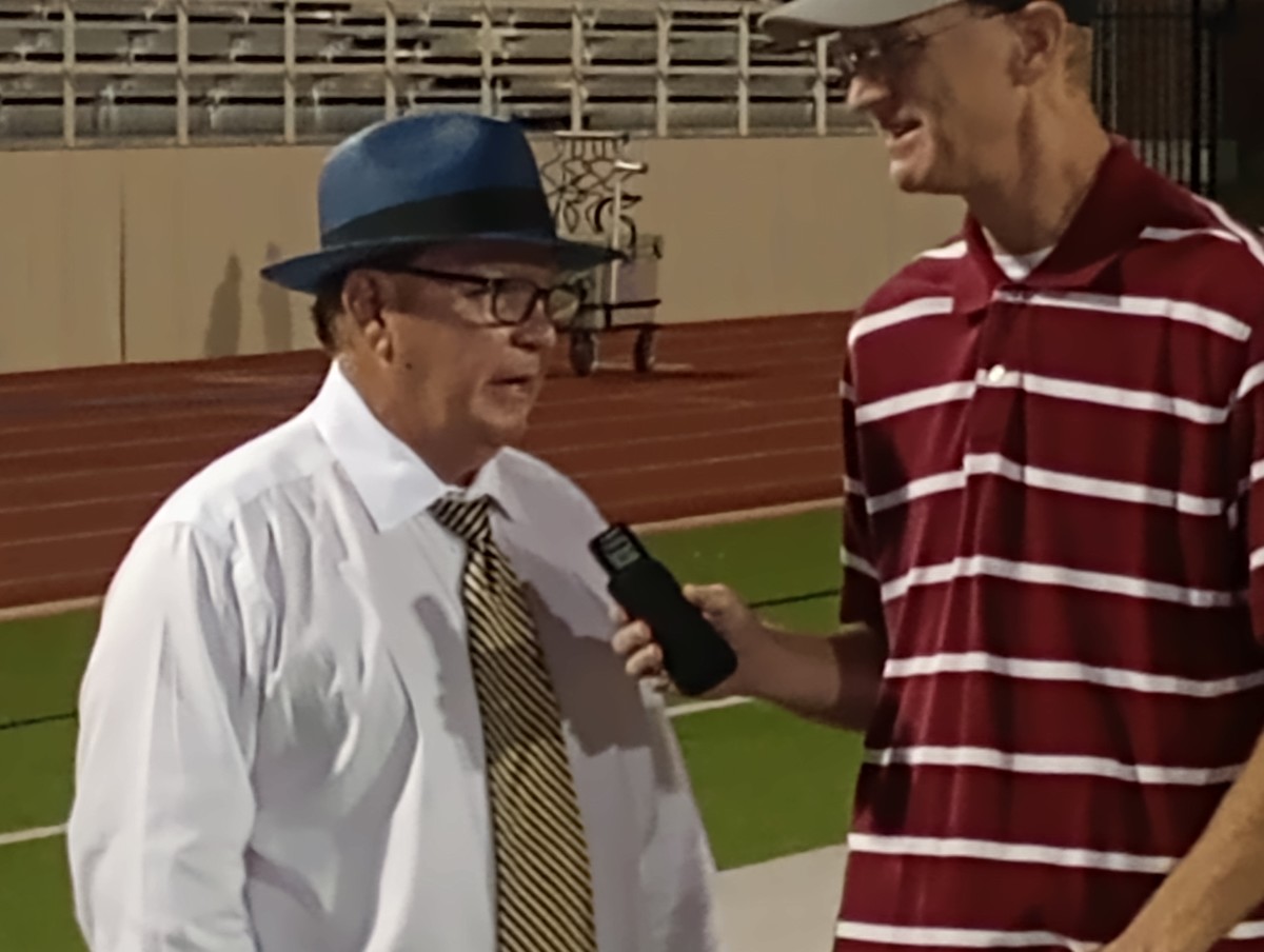 Highland Park coach Randy Allen (left) is interviewed after the Scots' 34-15 win at Richardson on Oct. 26, 2023.