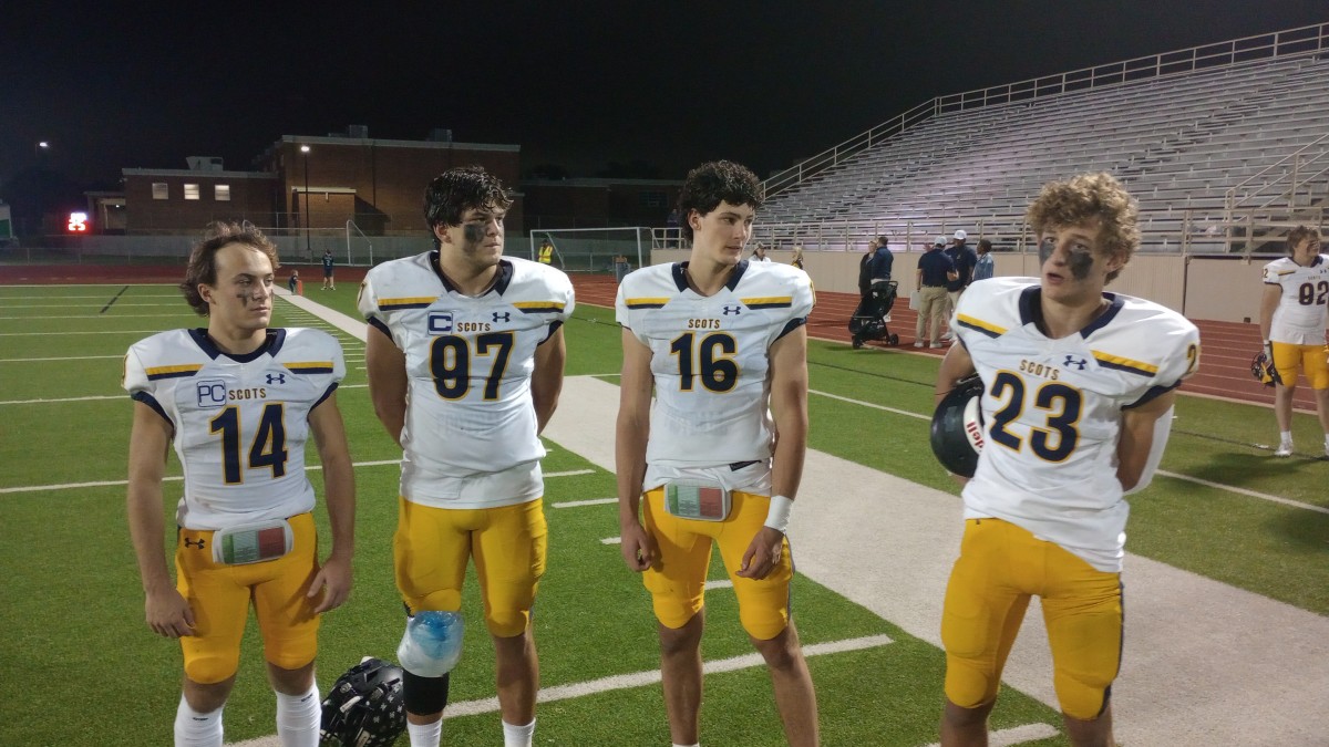 Highland Park players (from left) Steel Tobin, Henry Richter, Parker Thompson and Jack McCallum discuss the Scots' 34-15 win at Richardson on Oct. 26, 2023.