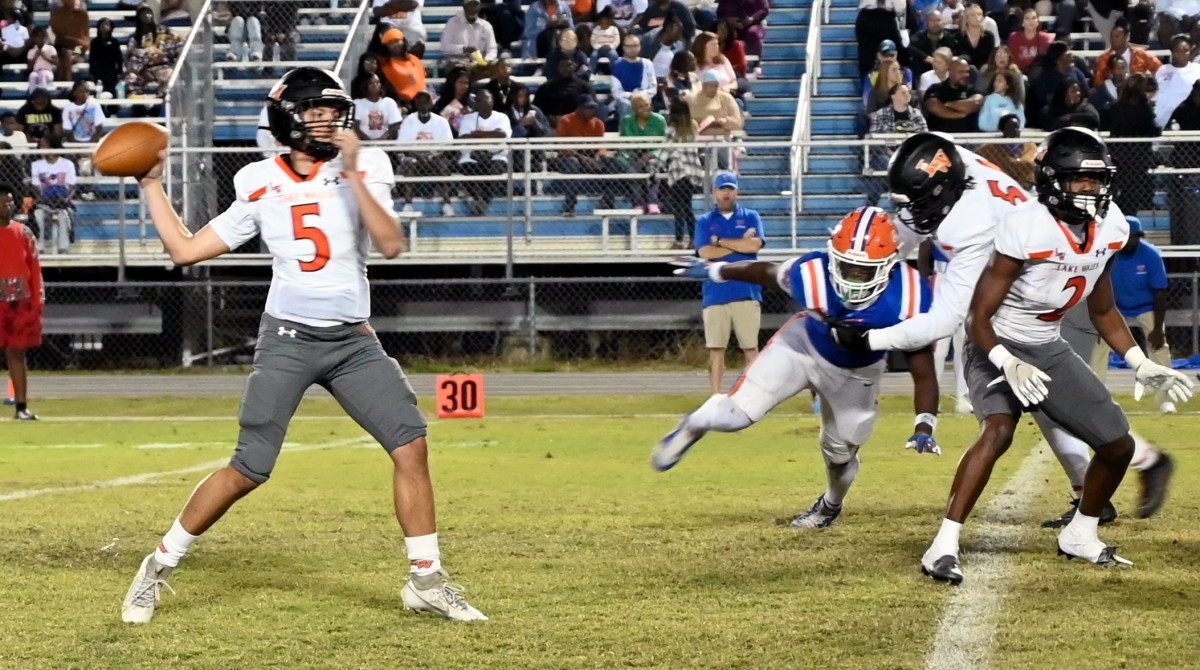 Lake Wales quarterback Brycen Levidiotis unleashes a pass against Bartow. The Highlanders won 28-3 for their 25th consecutive win. 