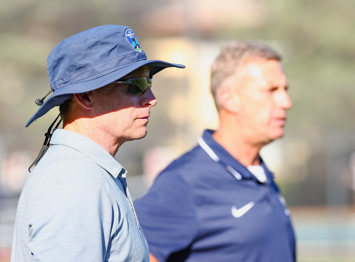 Menlo School flag football coaches Steve Young (left) and John Paye during a recent game with Skyline of Oakland 