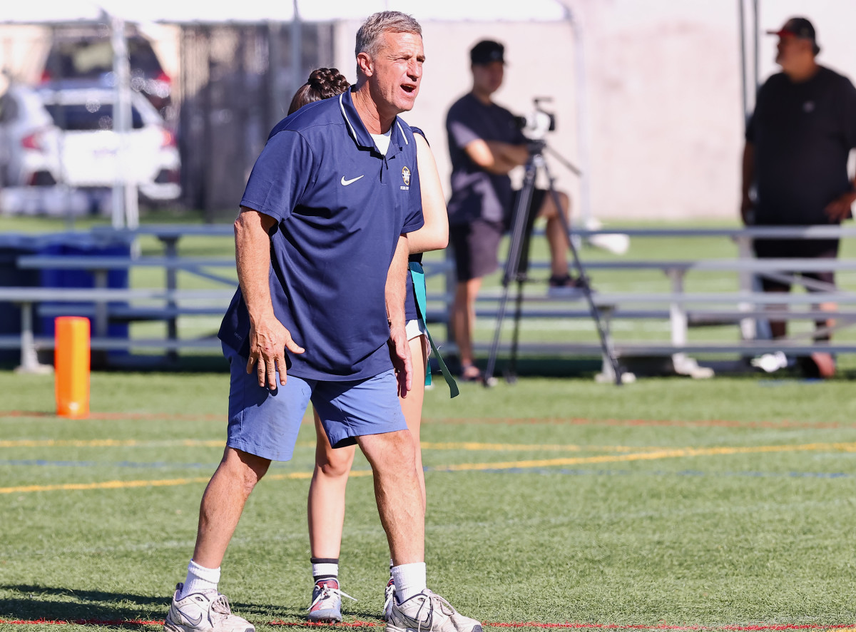John Paye also helps coach the boys football team as an assistant.