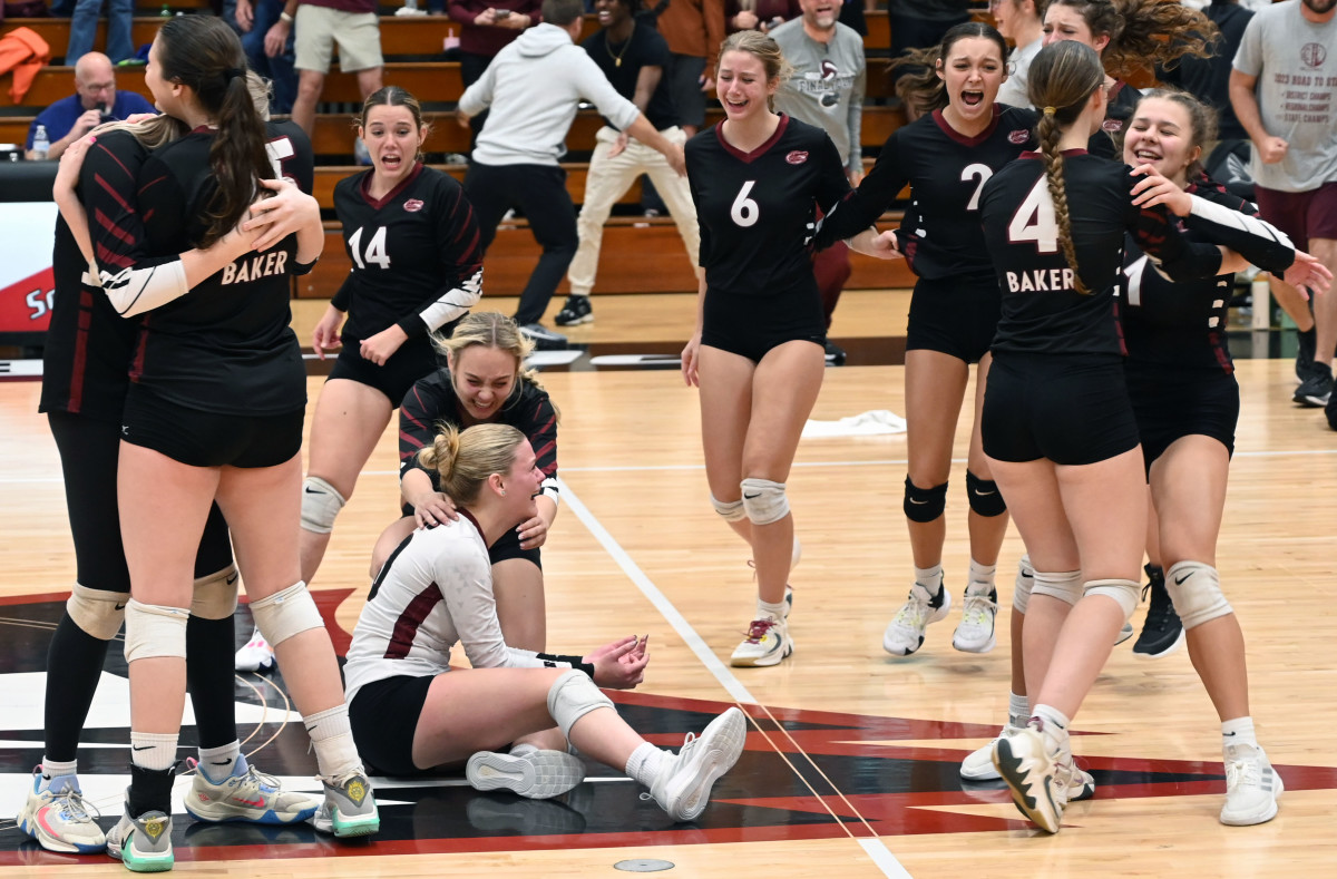 Baker players celebrate the first girls volleyball state championship on school history after beating Branford in four sets at the FHSAA girls volleyball championships Tuesday at Polk State College in Winter Haven. 