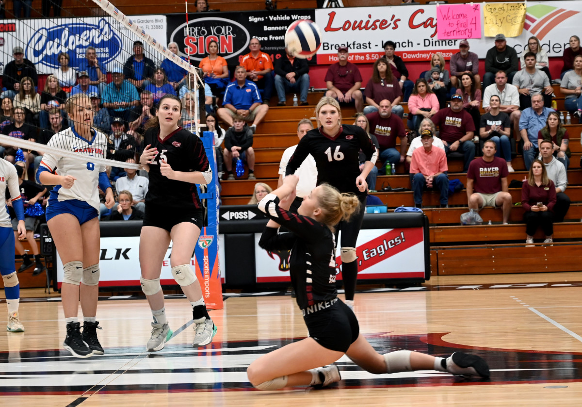 Baker junior outside hitter Kaleigh Moss saves a shot during the state Class 1A state championship match against Brandford at the FHSAA girls volleyball championships Tuesday at Polk State College in Winter Haven. 