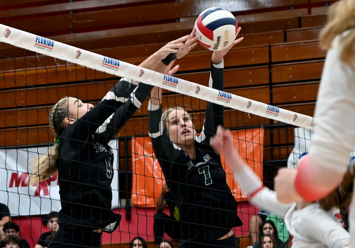 Westminster Christian players Gigi Artiles (7) and Jazmine Nicolas (9) block a Tampa Carrollwood Day shot during the Class 3A state championship match on Thursday at the FHSAA girls volleyball state finals at Polk State College in Winter Haven. 