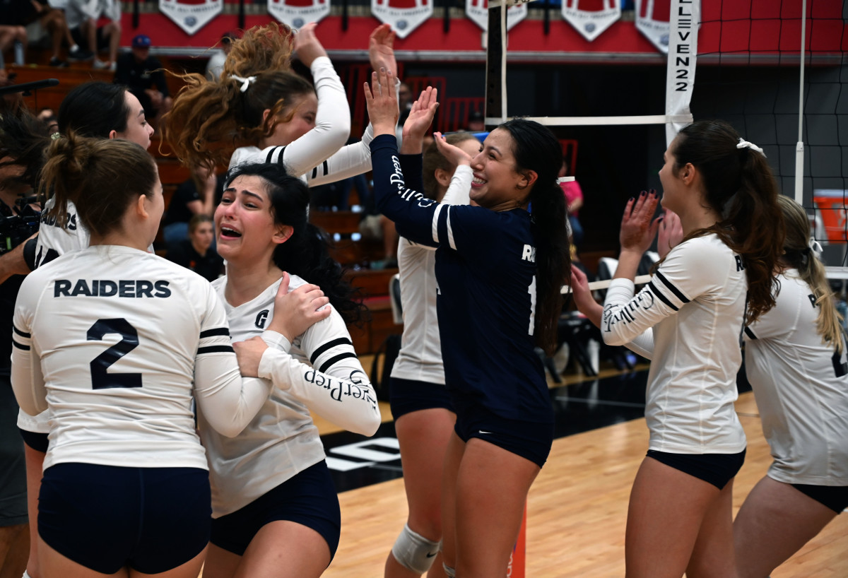 Gulliver Prep players hug and celebrate after winning the Florida Class 3A girls volleyball state championship Saturday at the FHSAA Finals at Polk State College in Winter Haven.