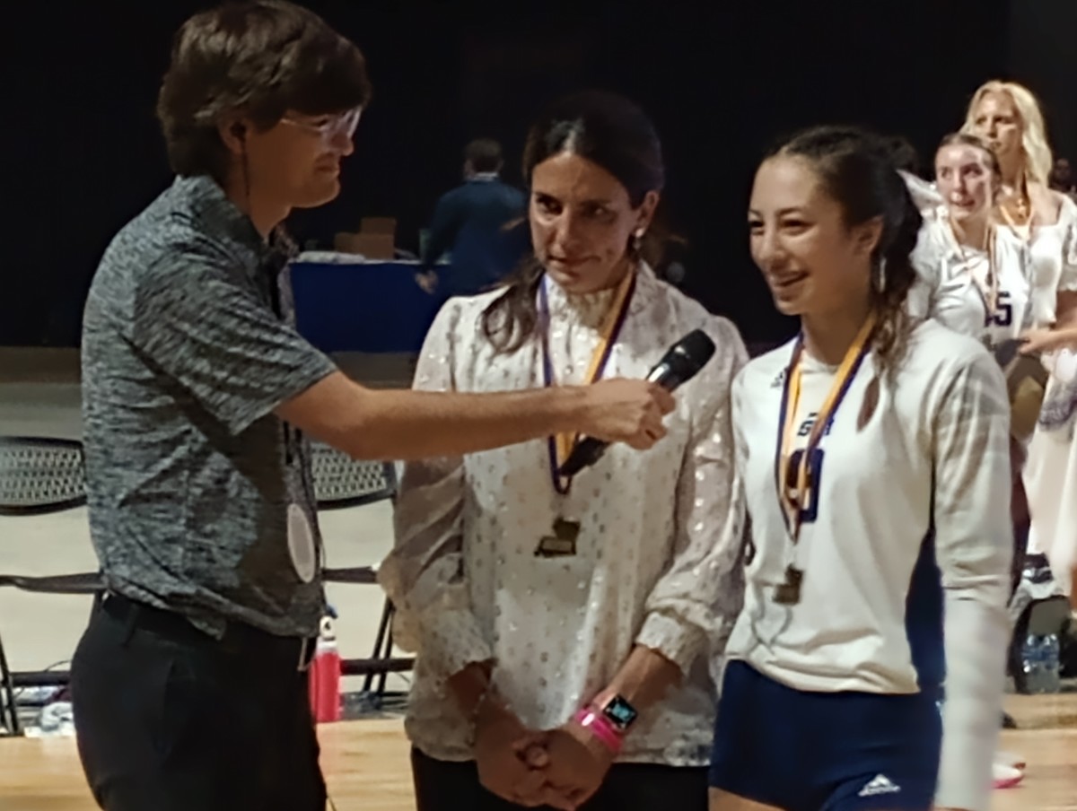 St. Thomas More coach Jes Burke (left) and junior Rhyan Miciotto - named the MVP - are interviewed following the Lady Cougars' win against Teurlings Catholic for the Division II volleyball championship on Nov. 11, 2023.