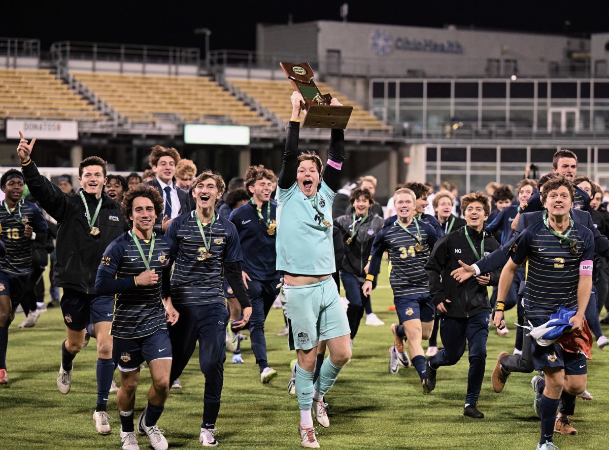 St. Ignatius soccer players celebrate winning the 2023 Division I state championship on November 11, 2023
