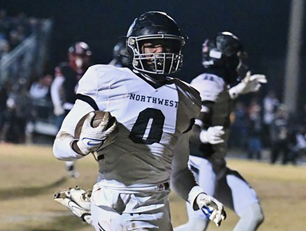 Northwest's Xavier Rivers (0) heads to the end zone after intercepting a pass in the second quarter of last week's Class 4A West Region second round game on 11/10/2023. The Jaguars stunned then-undefeated and defending state champ Quince Orchard to advance to Friday's state quarterfinals.