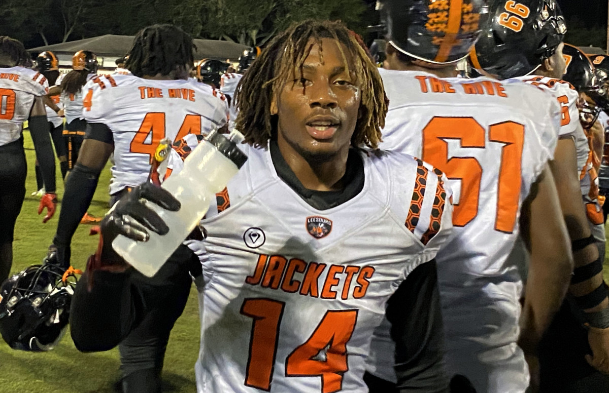 Leesburg defensive back Phillip George gets a swig of water after delivering a 60-yard pick-6 to tie the Class 3S playoff game with Lake Wales. 