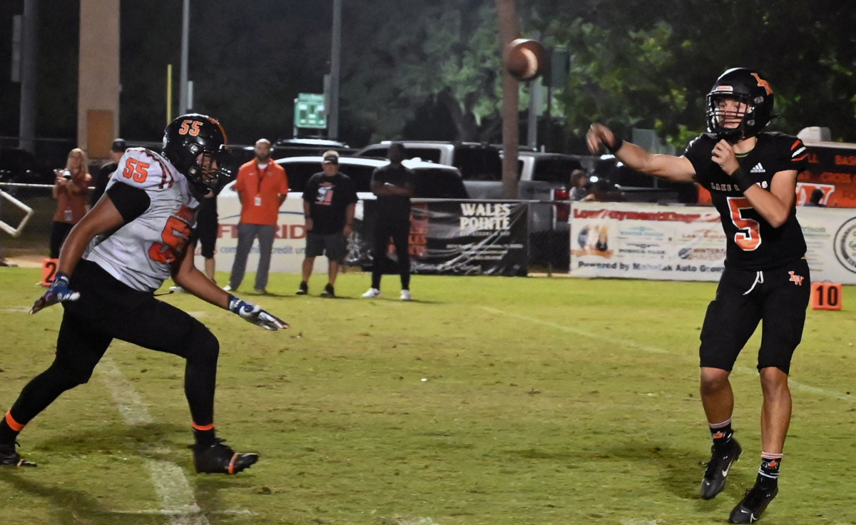 Lake Wales quarterback Brycen Levidiotis gets off a pass during a Class 3S playoff game against Leesburg.  