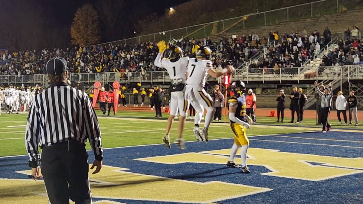 North Allegheny quarterback Logan Kushner (No. 7) celebrates with wide receiver Evan Lyon after Kushner scored a touchdown against Pittsburgh Central Catholic in the WPIAL Class 6A championship game on November 18, 2023. Photo credit: Ryan Isley, SBLive Sports