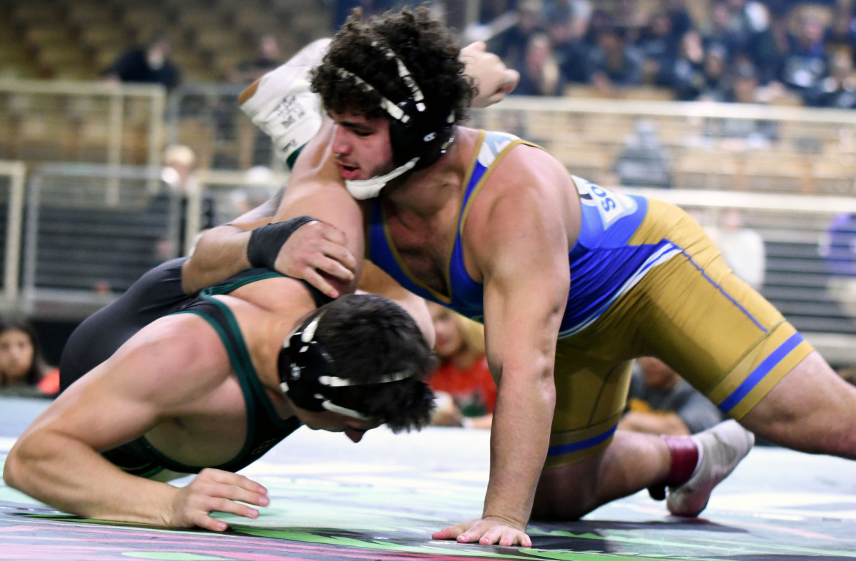 Miami South Dade junior Sawyer Bartelt roars to his third-straight championship during the 220-pound title match against Saint Vincent Saint Mary (Ohio) senior Bryson Getz at the 2023 Knockout Christmas Classic in December at Silver Spurs Arena in Kissimmee.