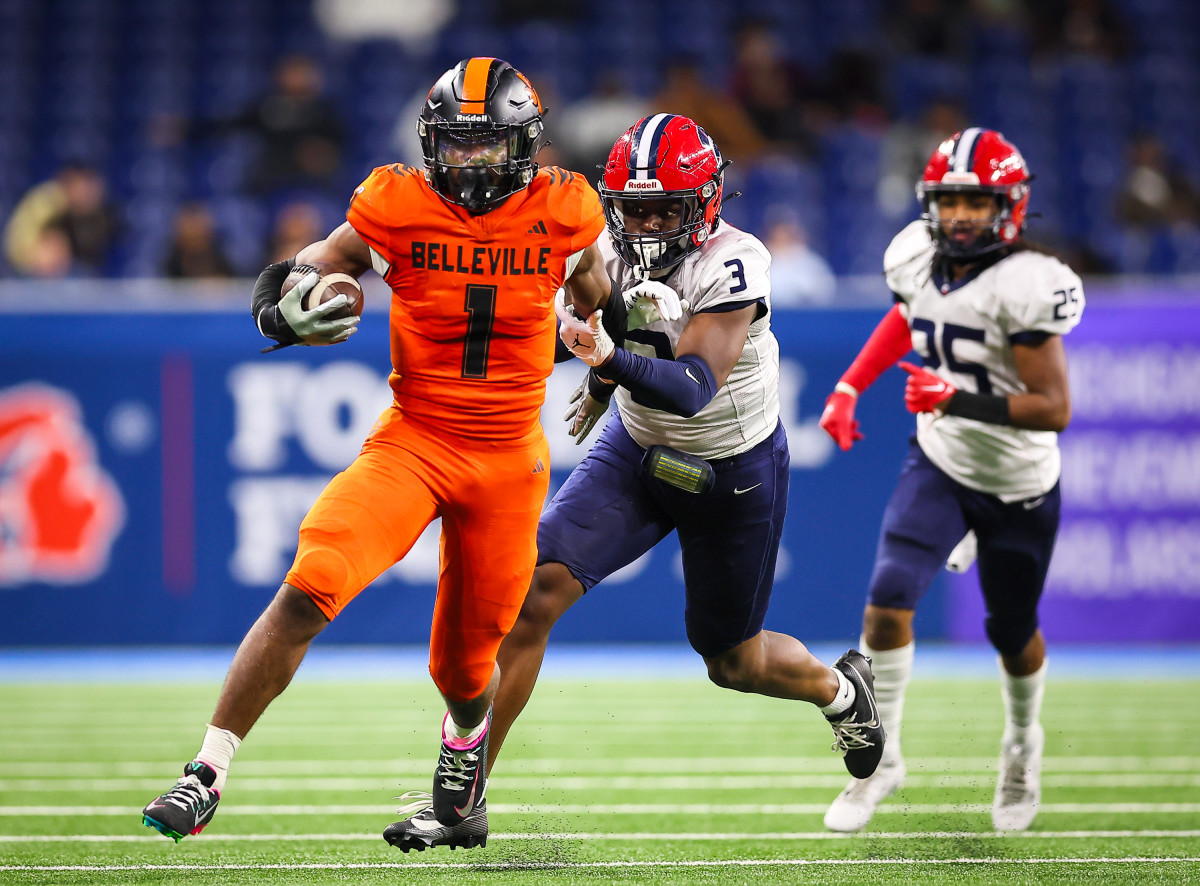 Beasley runs with the football in the MHSAA Division 1 title game against Southfield A&T. He played at an all-state level on both sides of the ball. Photo by Mariusz Nowak.