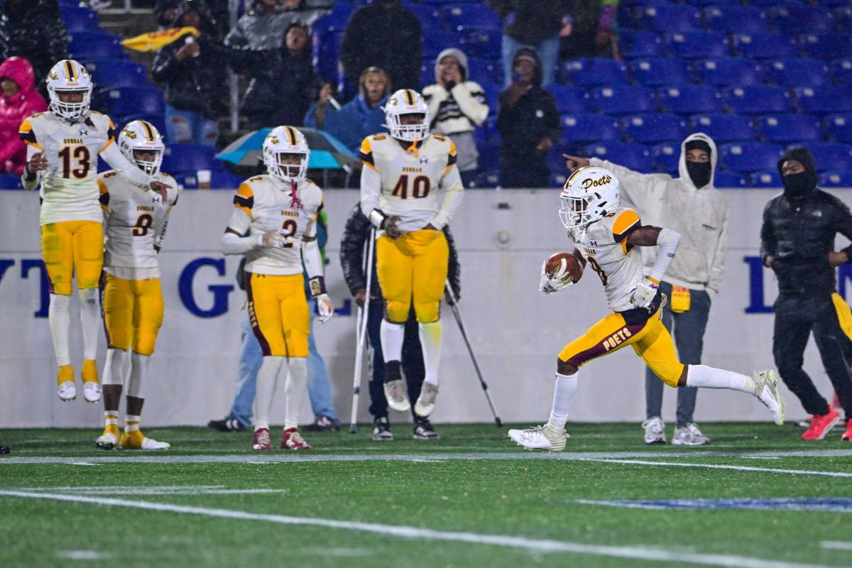 In the game's most explosive offensive play, Dunbar's Antonio Lyde races down the sideline after getting loose for a 46-yard touchdown run. It would be the only score of the contest and it propelled Dunbar to its 13th Maryland state football championship.