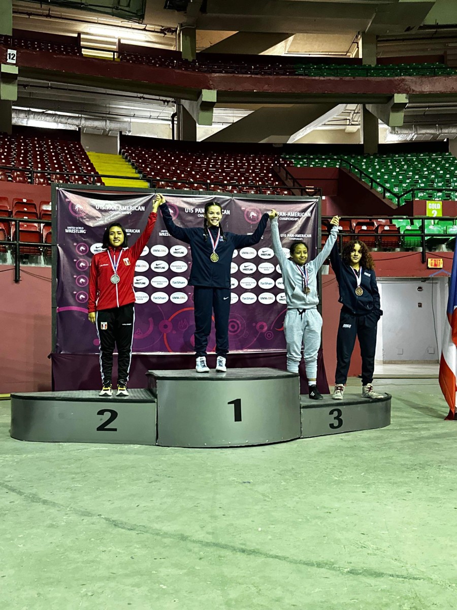 Mia Ortiz-Martinez (far right) joins other wrestlers on the medal stand during the 45 kilo ceremony at the Pan American Games. She was a bronze medalist.