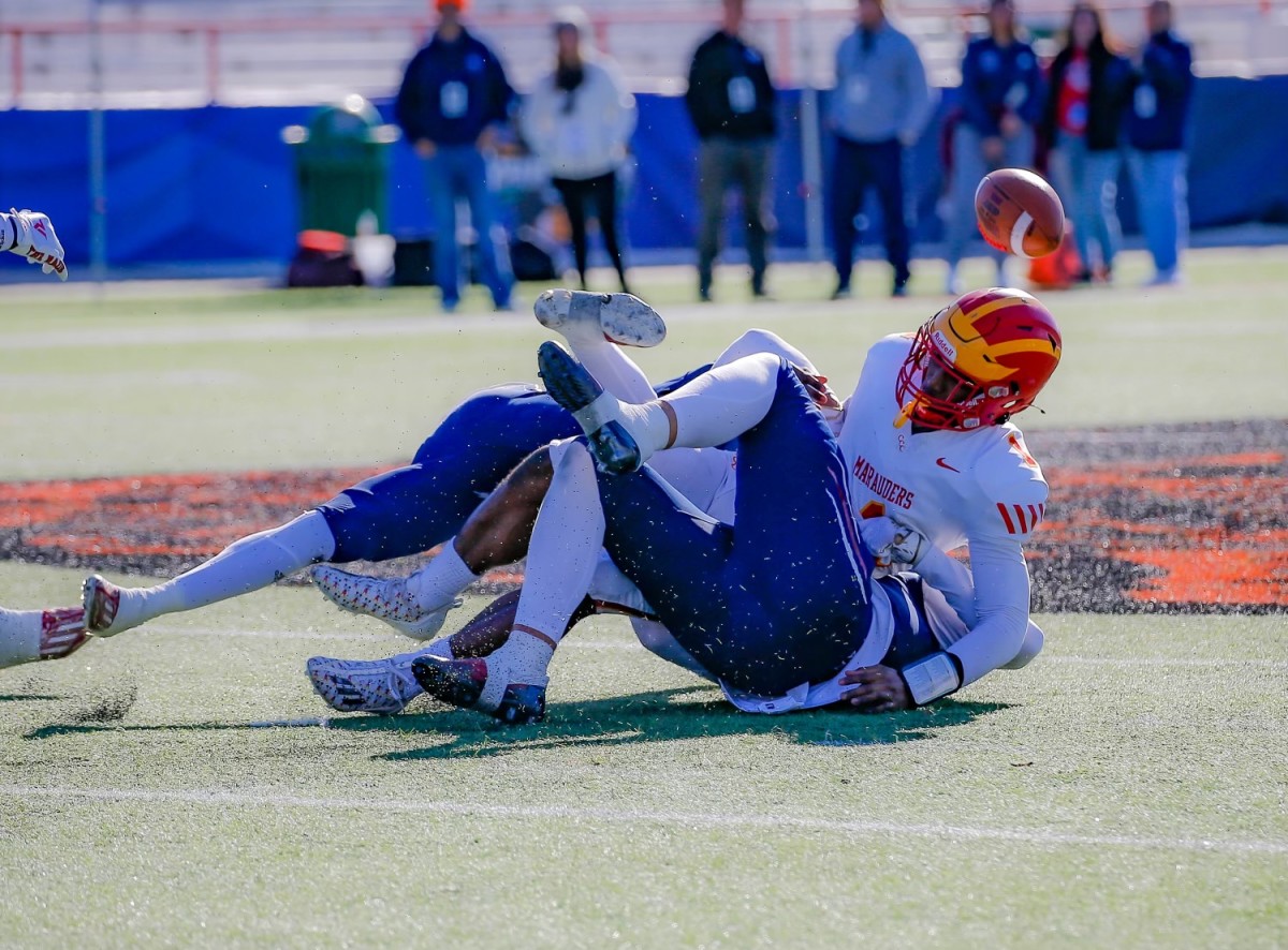 Chaminade-Madonna's Zack Crothers (bottom) records a strip sack of Clearwater Central Catholic's Jershaun Newton in the FHSAA 1M state championship game. 12/7/2023