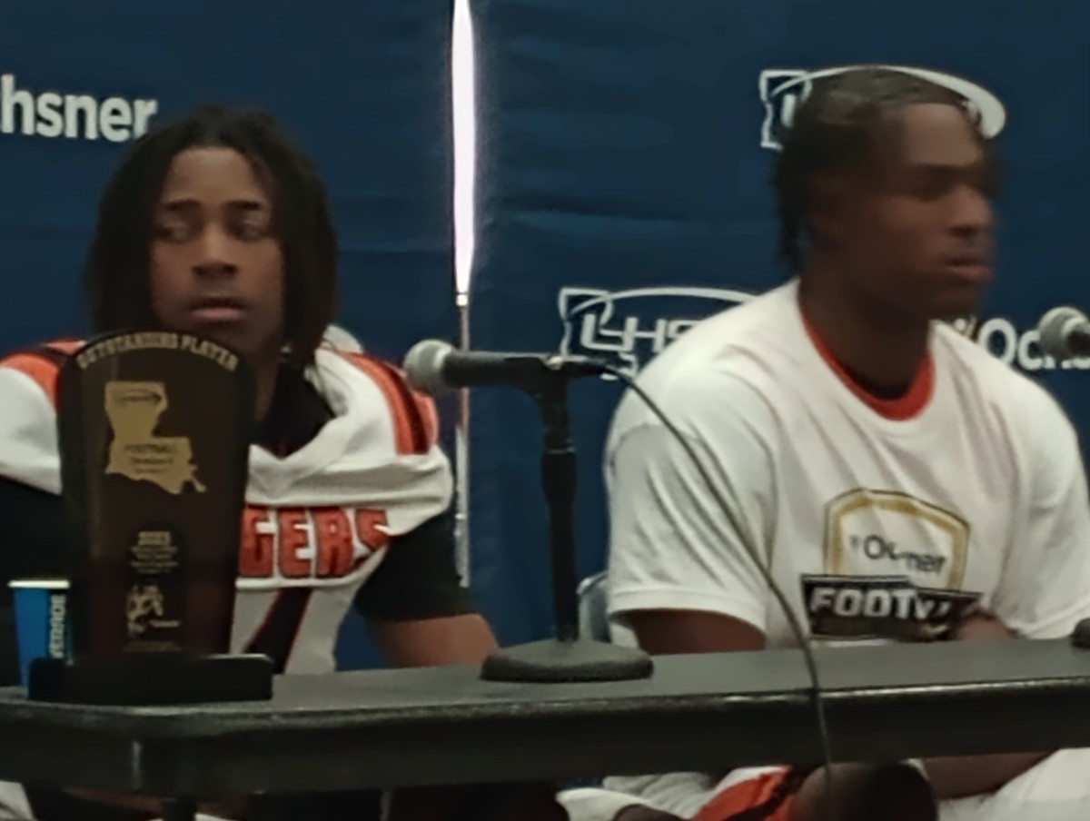 Opelousas players Zackeus Malveaux (left) and Jamorian Daughtery listen to a question at a press conference following the Tigers' Division II non-select championship win Dec. 8, 2023.