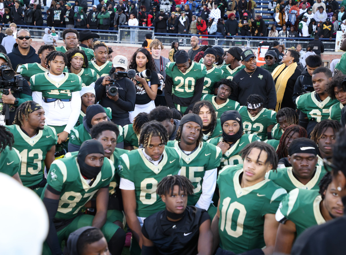 DeSoto football players gather after a 6A Division II state semifinal win over Southlake Carroll.