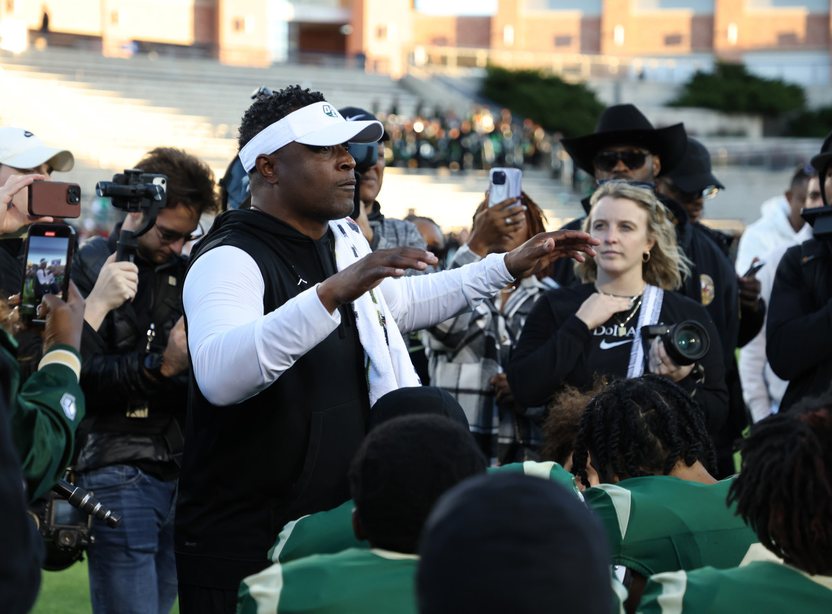 DeSoto coach Claude Mathis talks to his team after a 2023 Class 6A Division II state semifinal win over Southlake Carroll at Allen ISD.