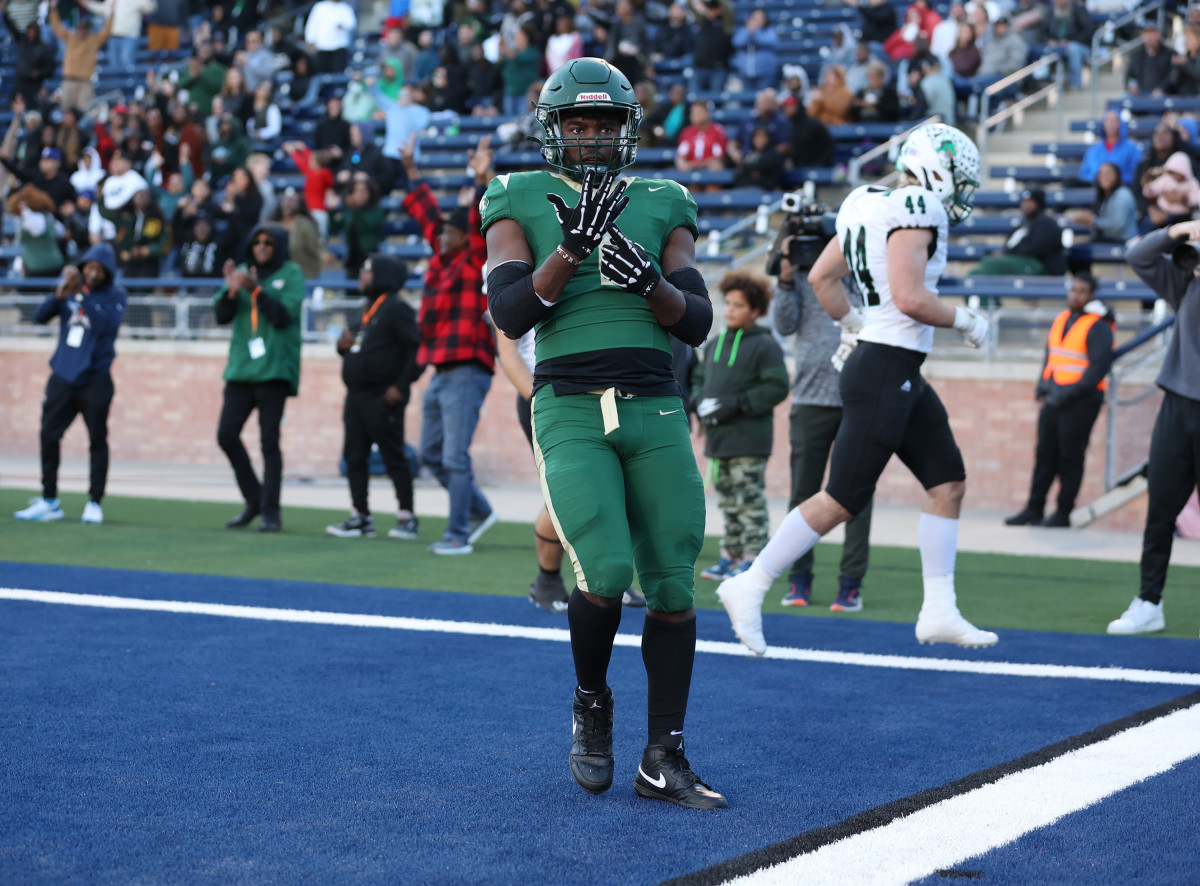 Deondrae Riden celebrates a touchdown during a monster UIL 6A division II state semifinal performance against Southlake Carroll.