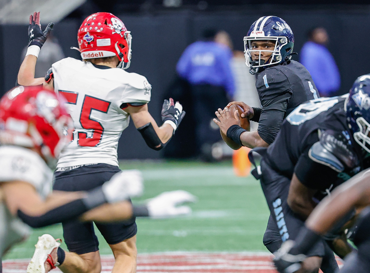 Cedar Grove quarterback Elliott Colson Jr. was locked in from the pocket all afternoon, as he passed for 259 yards and four touchdowns, in the Saints' 49-28 rout of Savannah Christian in the GHSA Class 3A football state championship game.