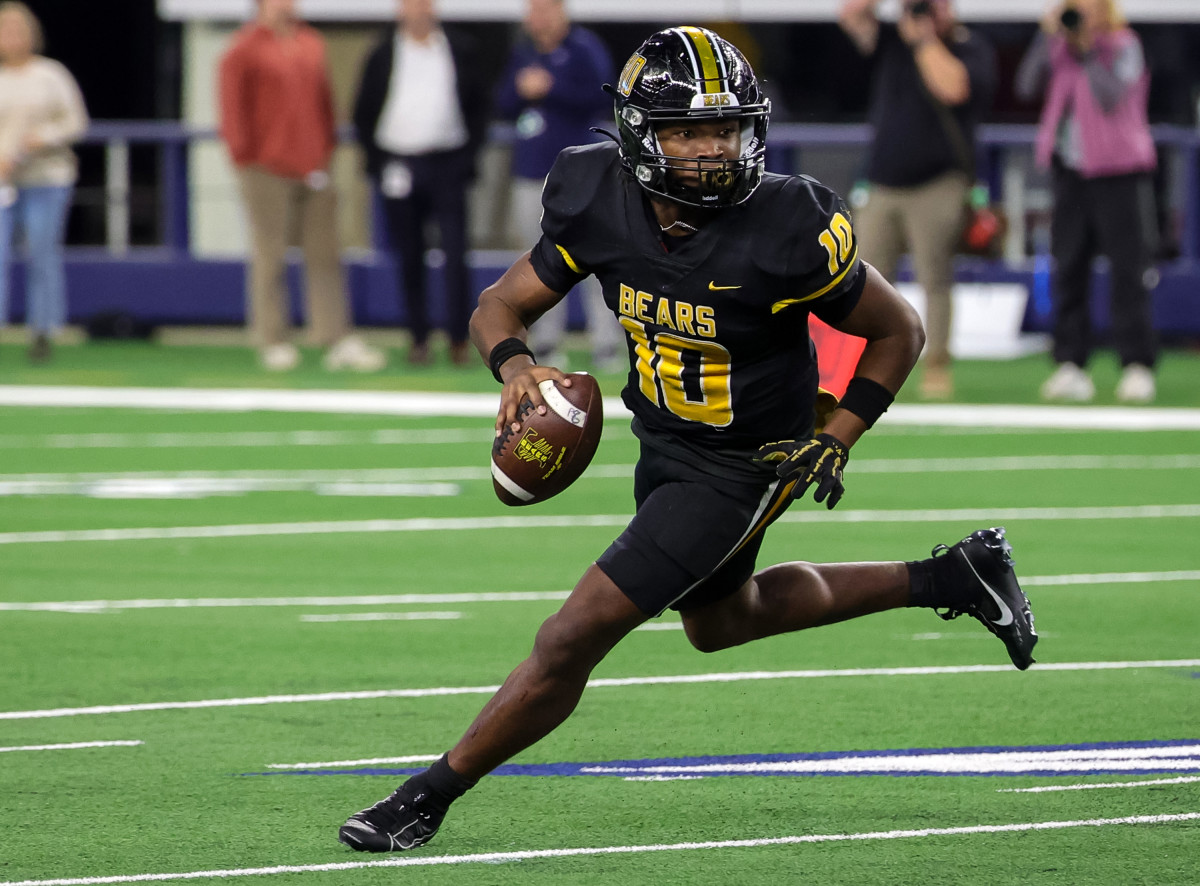 Terry Bussey, 5-star Texas A&M commit, rolls out of the pocket during a record-smashing state title win over Tolar on Wednesday.