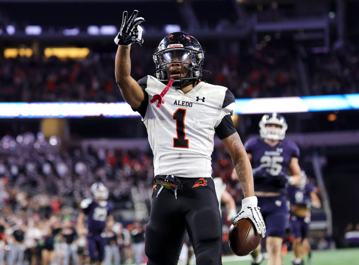 Hawk Patrick-Daniels celebrates a touchdown in Aledo's thrashing of Smithson Valley in the 5A Division I Texas state title on Saturday.