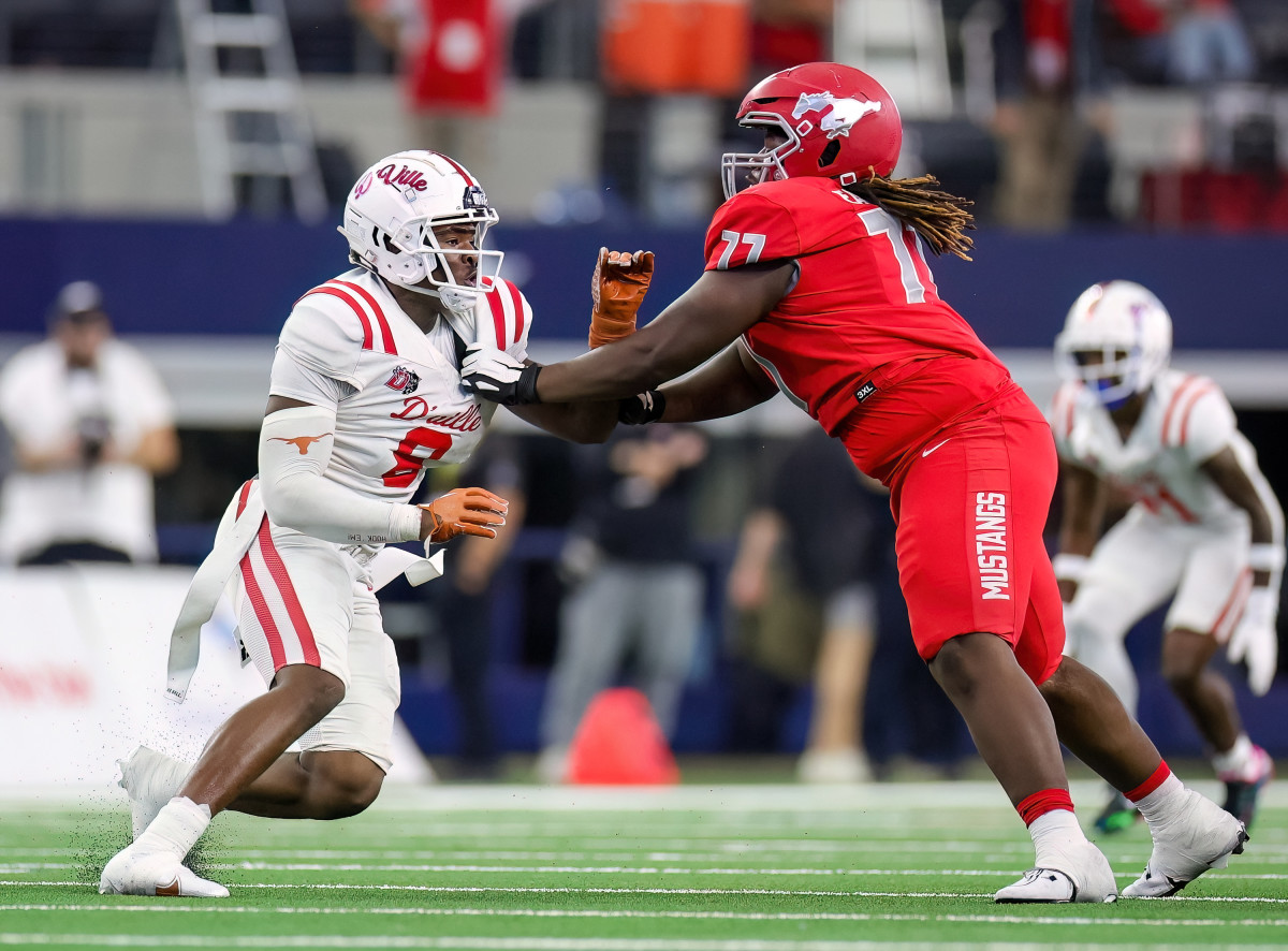Duncanville's Collin Simmons (left) attempts to evade North Shore OL Jakoby Isom in a UIL 6A Division I state title on Dec. 16, in which Simmons was named the game's back-to-back defensive MVP.
