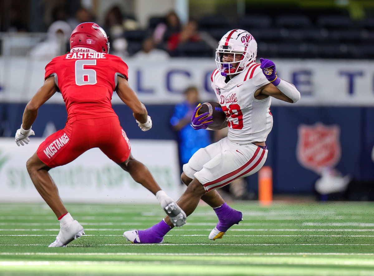 Caden Durham evades a North Shore defender in the 2023 UIL 6A Division I state championship at AT&T Stadium in December.