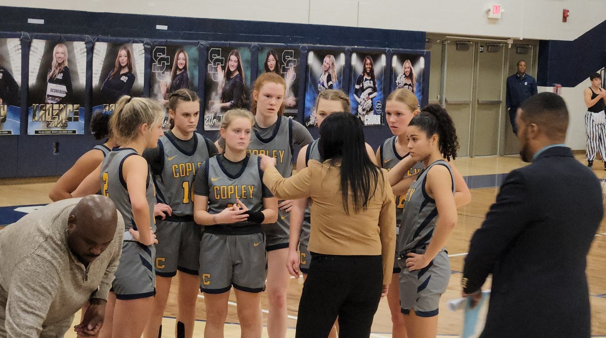 Copley head coach Julie Solis talks to her team during the fourth quarter of a win over Solon on December 20, 2023. Photo credit: Ryan Isley, SBLive Sports 