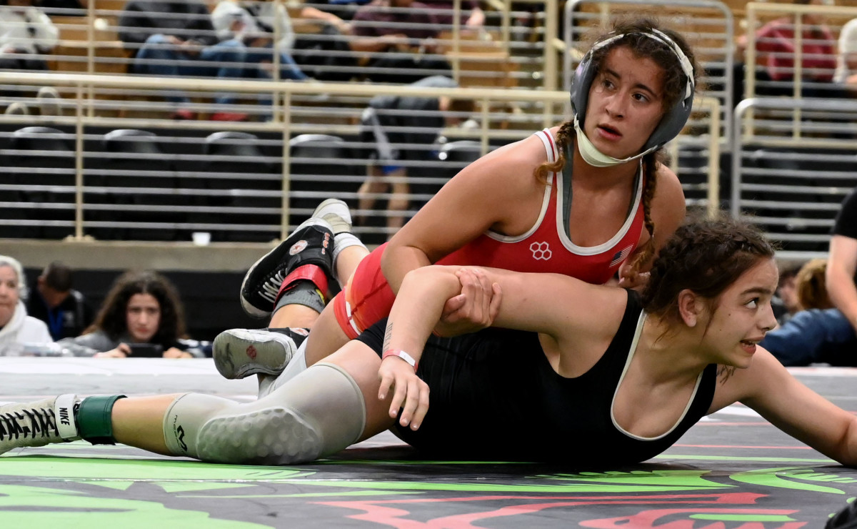 Bryanne Kaminsky from University High School works her way to the 135-pound championship at the Knockout Christmas Classic at Silver Spurs Arena in Kissimmee on Thursday.