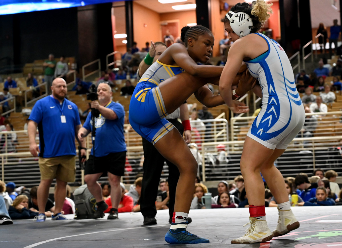 Iyonna Church from Charlotte wins the 115-pound division against Paola Ramirez from Osceola at the Knockout Christmas Classic at Silver Spurs Arena in Kissimmee on Thursday.