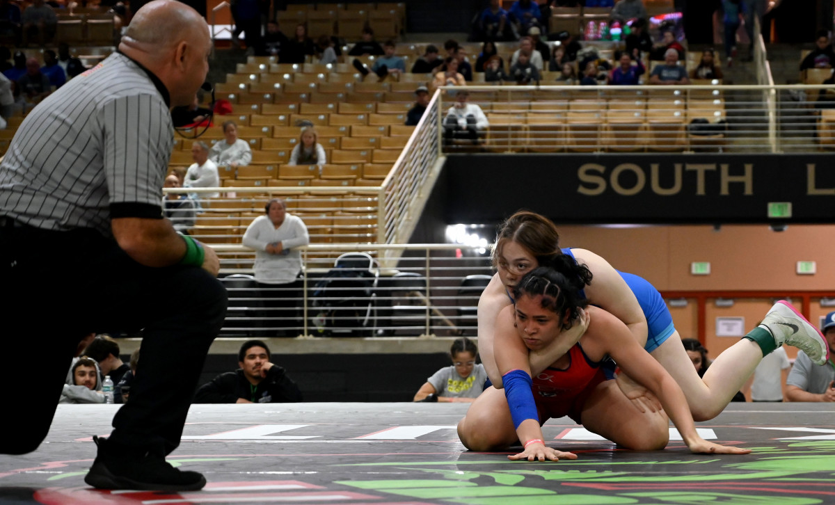 Piper Fowler from Cleveland (Tennessee) wins the 170-pound division championship against Salexa Lontoc-Oritz from Orlando Freedom at the Knockout Christmas Classic at Silver Spurs Arena in Kissimmee on Thursday. Cleveland won the girls team championship.