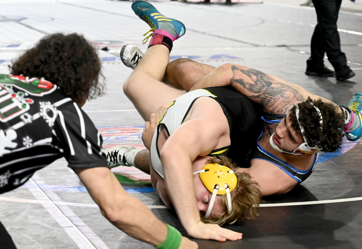 Sawyer Bartelt from South Dade works his way to a semifinals win against Kaleb Ivie from Merritt Island in a 215-pound match on Saturday at the Knockout Christmas Classic at Silver Spurs Arena in Kissimmee. 