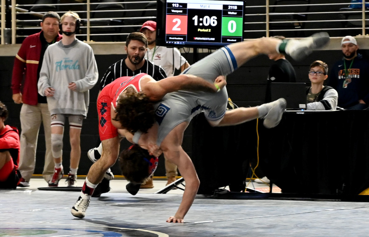 Christian Vazquez from Doral Academy picks up a win against Chase Walker from Cleveland during 113-pound semifinals match on Saturday at the Knockout Christmas Classic at Silver Spurs Arena in Kissimmee.