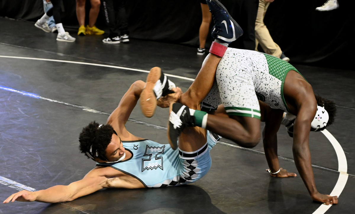 Nikolas Hoffman of Hagerty picks up a win against Colson Hoffman from Central during 138-pound semifinals match on Saturday at the Knockout Christmas Classic at Silver Spurs Arena in Kissimmee. 