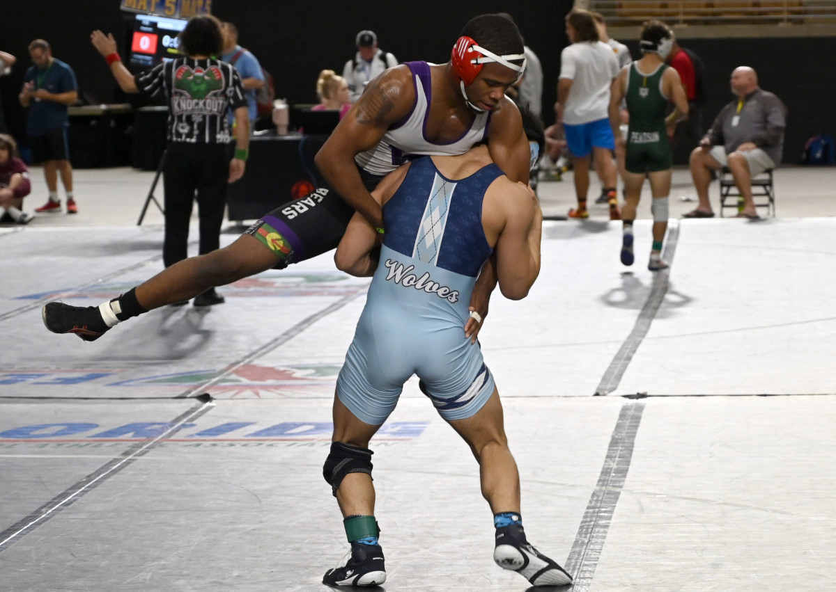 Jaydon Robinson of Winter Spring advances to the finals with a win against Kyle Lew of Houston Westside during a 144-pound semifinals match on Saturday at the Knockout Christmas Classic at Silver Spurs Arena in Kissimmee. 