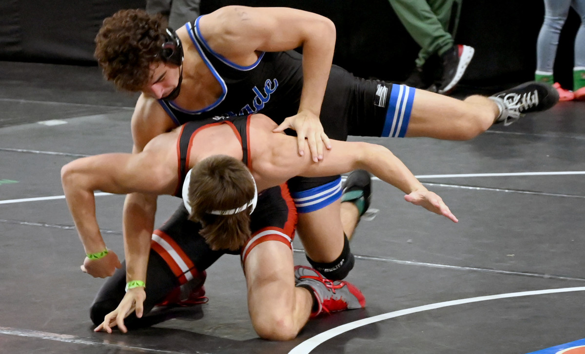 Seth Larson of Flowery Branch gets a win against Gavin Balmeceda of South Dade during a 157-pound semifinals match on Saturday at the Knockout Christmas Classic at Silver Spurs Arena in Kissimmee. 