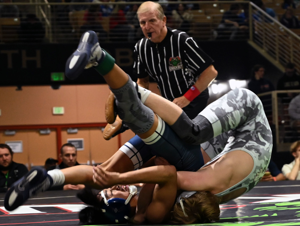 Gabe Swann of Central wins the 106-pound title match against Keagan Mesina of Mater Lakes Academy on Saturday at the Knockout Christmas Classic at Silver Spurs Arena in Kissimmee. 
