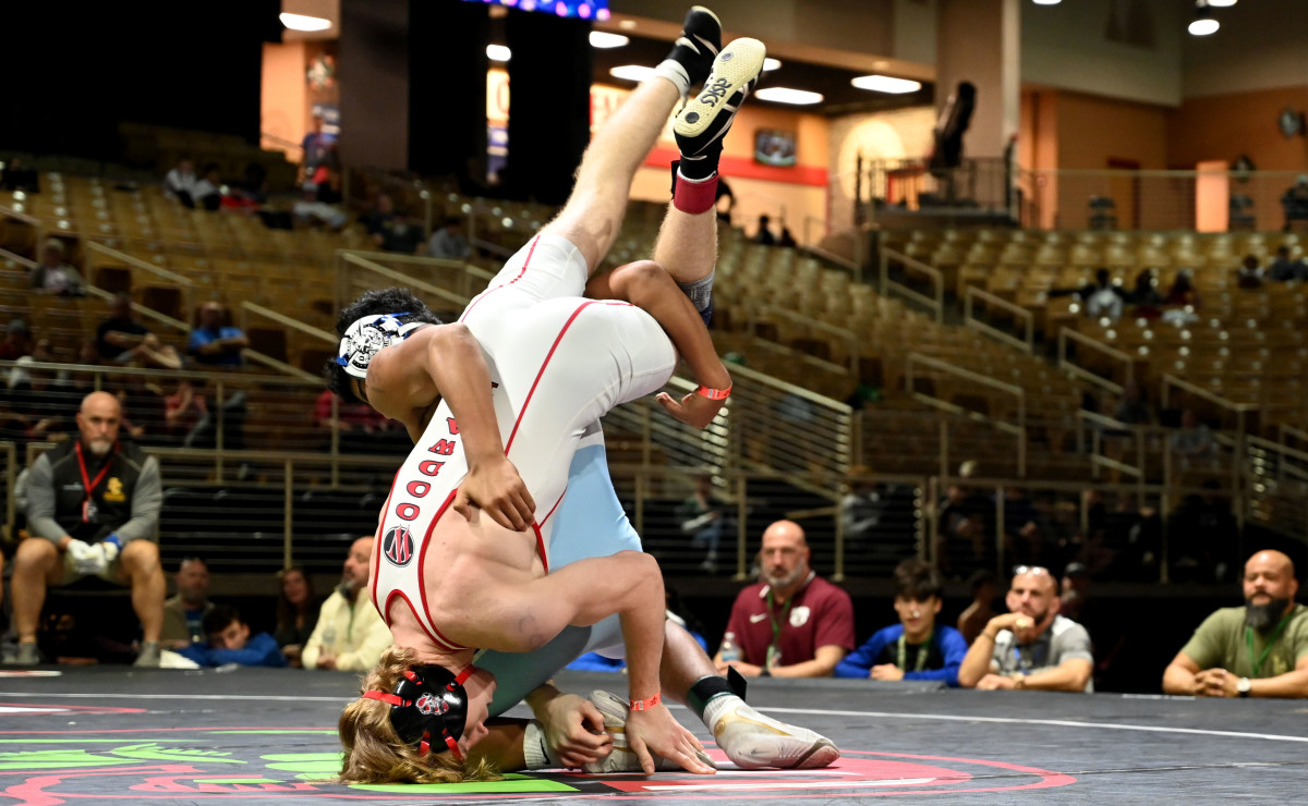 Jovani Solis of Somerset gets a 5-3 overtime win against Tanner Spalding during the 132-pound title match on Saturday at the Knockout Christmas Classic at Silver Spurs Arena in Kissimmee. 