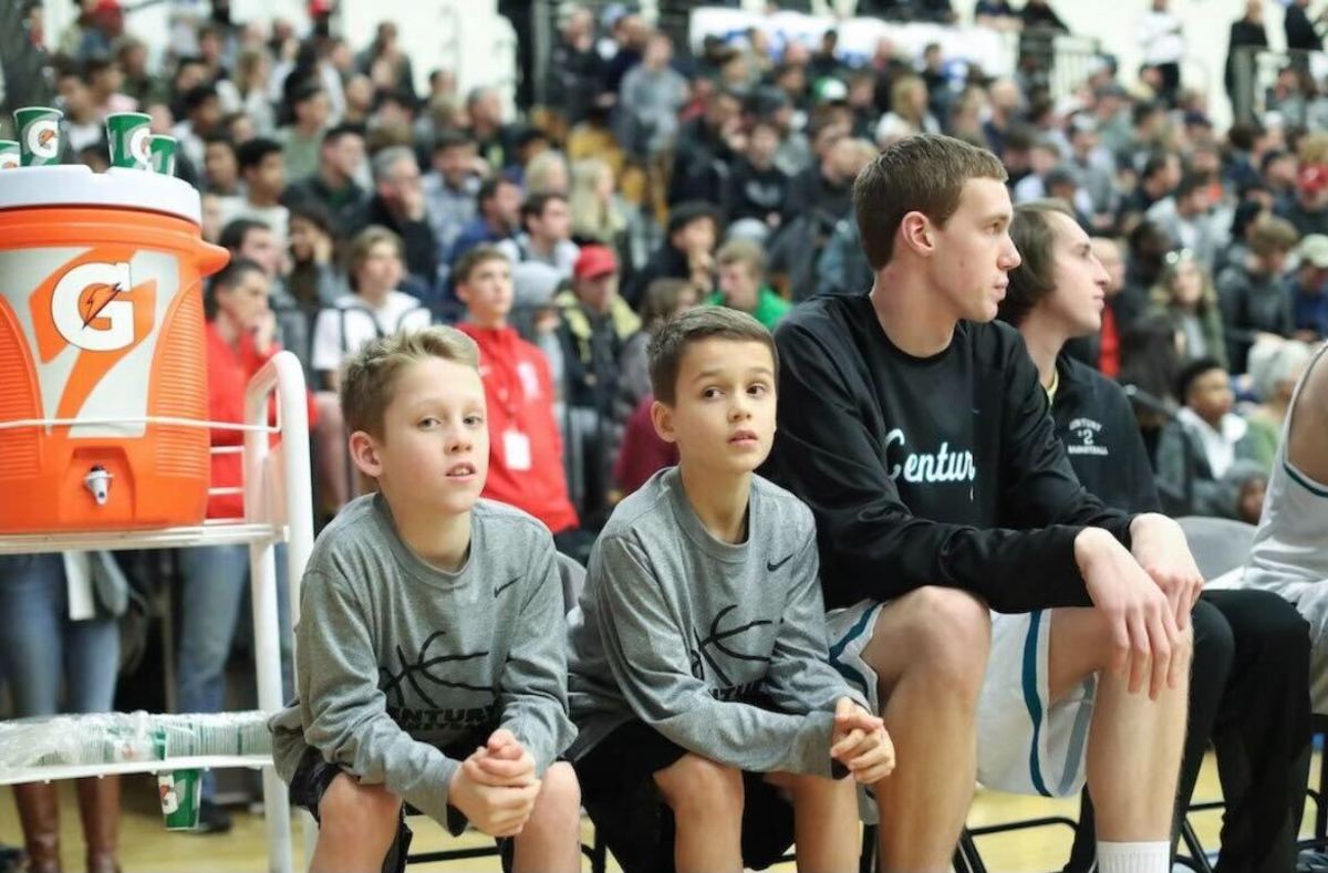 Kaden Groenig (left) and Drew Groenig — ages 11 and 9 — participate in the Les Schwab Invitational as ball boys in 2016. The two returned to play in the event as Southridge basketball players six years later.